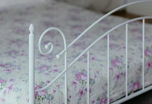 Bed with flowery sheets